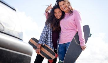 Mother and daughter having quality time with skateboards